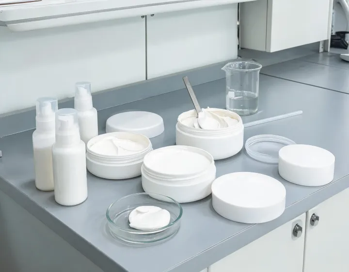 bulk sunscreen on a cosmetics bench, illustration only